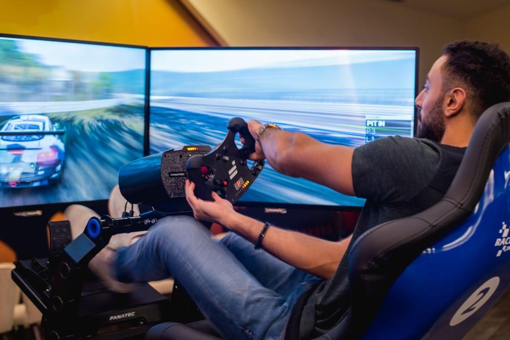 Bay La Sun Hotel And Marina - Emaar King Abdullah Economic City Kültér fotó A racing game player using a steering wheel